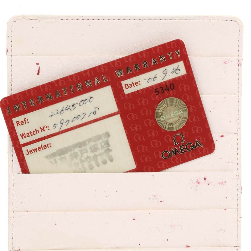 The image shows the warranty card for an Omega Seamaster 2264.50.00 Men
s Stainless Steel Black Dial 2264.50.00 Men
s Stainless Steel Black Dial watch, partially inserted in a light-colored cardholder.