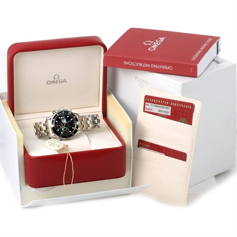 The Omega Seamaster 213.30.42.40.01.001 Men
s Stainless Steel Black Dial 213.30.42.40.01.001 Men
s Stainless Steel Black Dial watch is shown in its open box, with an operating instructions booklet and chronometer certificate.