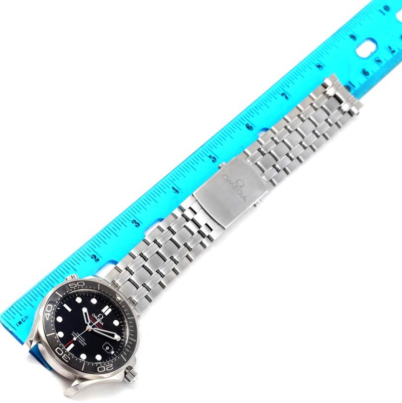 The Omega Seamaster 212.30.41.20.01.003 Men
s Stainless Steel Black Dial 212.30.41.20.01.003 Men
s Stainless Steel Black Dial watch is shown at an angle displaying its face, bezel, and metal bracelet alongside a ruler.