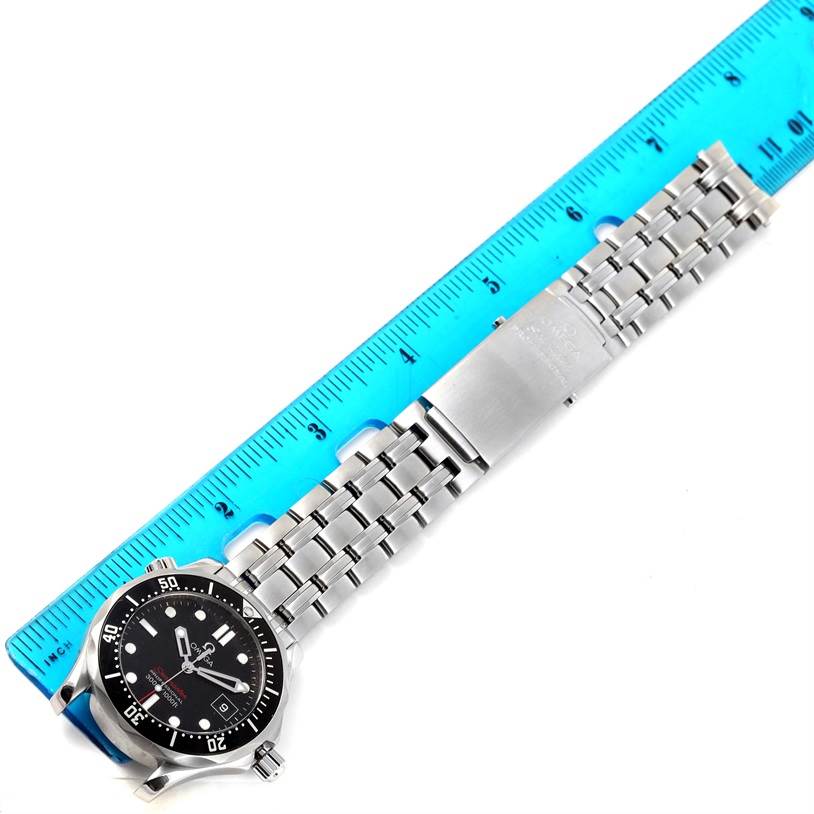 This image displays the Omega Seamaster 212.30.28.61.01.001 Men
s Stainless Steel Black Dial 212.30.28.61.01.001 Men
s Stainless Steel Black Dial watch and its metal bracelet fully extended alongside a ruler.