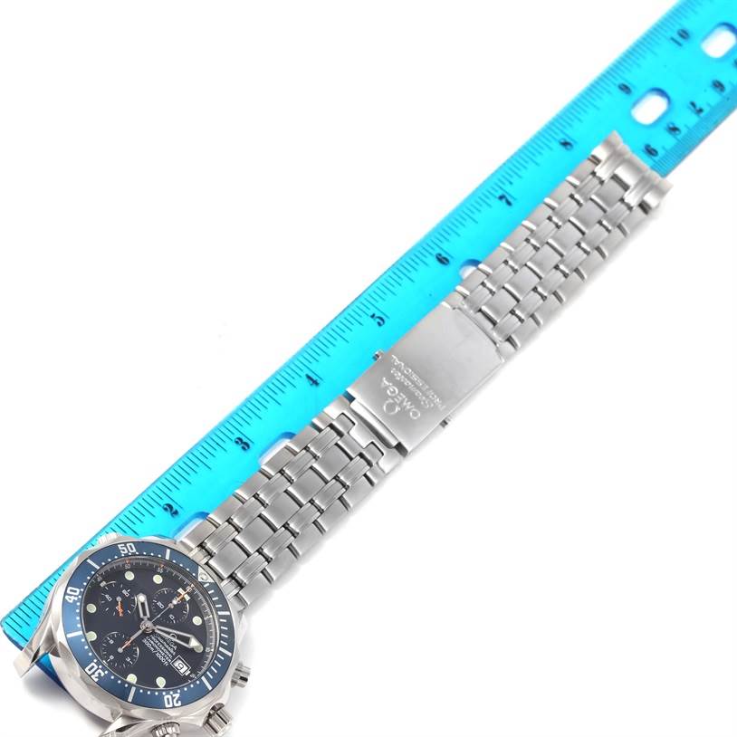 The image shows an Omega Seamaster 2599.80.00 Men
s Stainless Steel Blue Dial 2599.80.00 Men
s Stainless Steel Blue Dial watch laid flat with its stainless steel bracelet and a ruler for size reference.