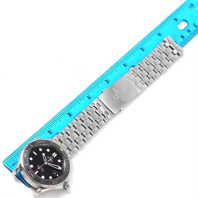 The Omega Seamaster 212.30.41.20.01.003 Men
s Stainless Steel Black Dial 212.30.41.20.01.003 Men
s Stainless Steel Black Dial watch is shown horizontally with a metal bracelet and a blue ruler for scale.