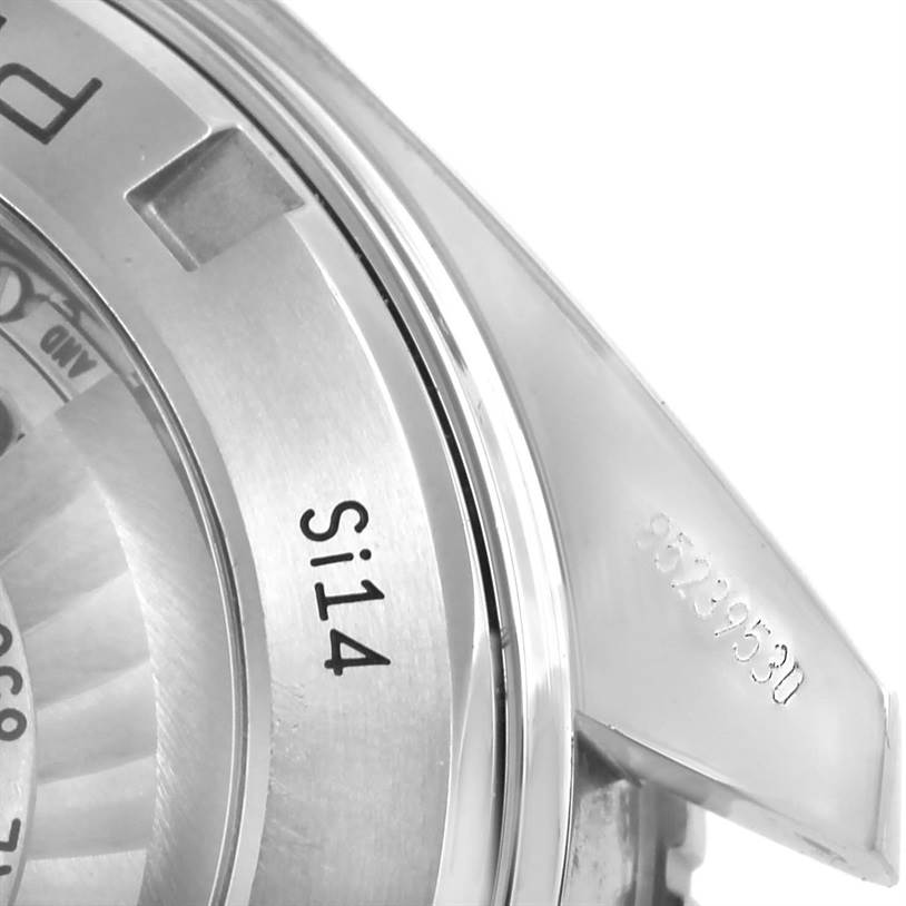 The image shows a close-up of the Omega Seamaster 232.30.42.21.01.003 Men
s Stainless Steel Black Dial 232.30.42.21.01.003 Men
s Stainless Steel Black Dial watch back case, highlighting the serial number and part of the mechanism.