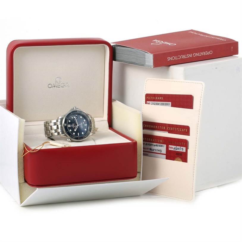 The image shows the Omega Seamaster 212.30.41.20.03.001 Men
s Stainless Steel Blue Dial 212.30.41.20.03.001 Men
s Stainless Steel Blue Dial watch in its open box with the instruction manual and certification cards beside it.
