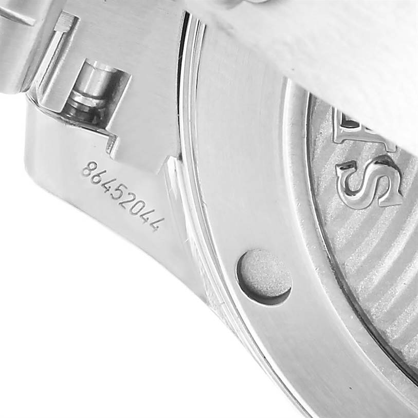 The image shows a close-up angle of the serial number and partial case back of an Omega Seamaster 212.30.36.20.03.001 Men's Stainless Steel Blue Dial 212.30.36.20.03.001 Men's Stainless Steel Blue Dial watch.