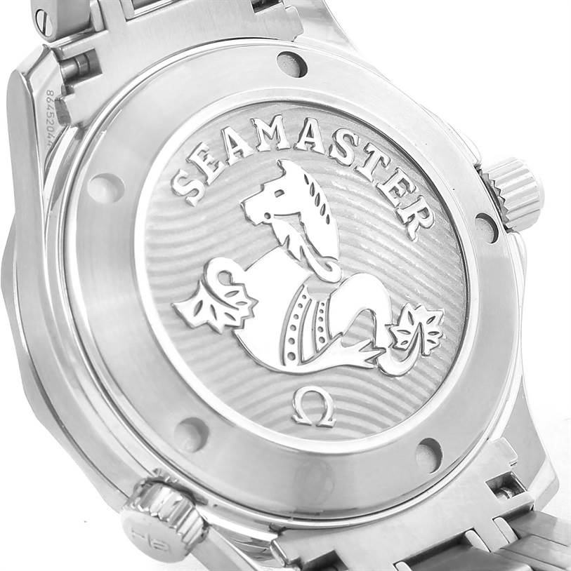 The image shows the backside of the Omega Seamaster 212.30.36.20.03.001 Men's Stainless Steel Blue Dial 212.30.36.20.03.001 Men's Stainless Steel Blue Dial watch, highlighting its engraved emblem and crown.