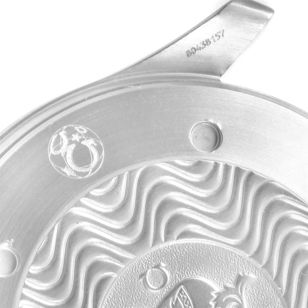 The image shows a close-up of the case back of an Omega Seamaster 2538.20.00 Men
s Stainless Steel White Dial 2538.20.00 Men
s Stainless Steel White Dial watch, featuring engraved wave patterns and serial numbers.