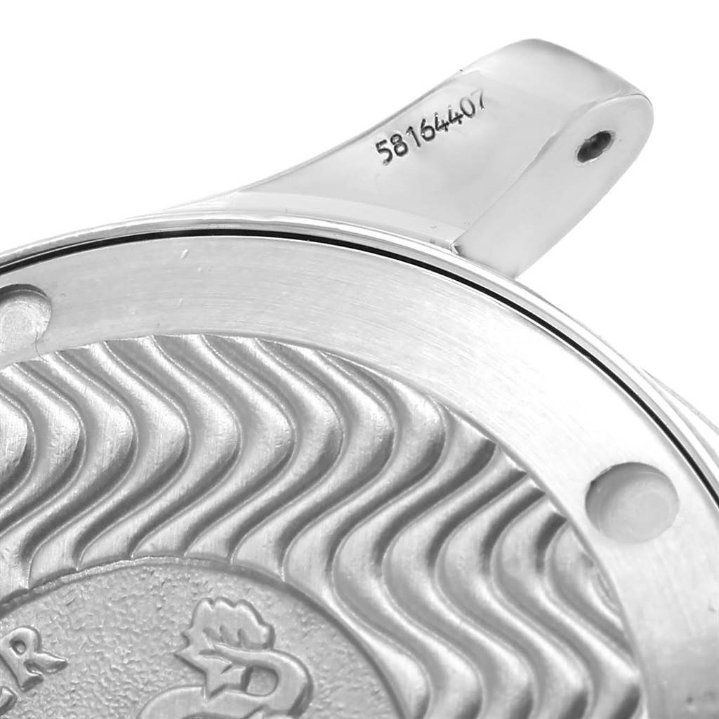 The image shows a close-up of the Omega Seamaster 2561.80.00 Men
s Stainless Steel Blue Dial 2561.80.00 Men
s Stainless Steel Blue Dial
s case back and serial number engraved on the watch
s lug.