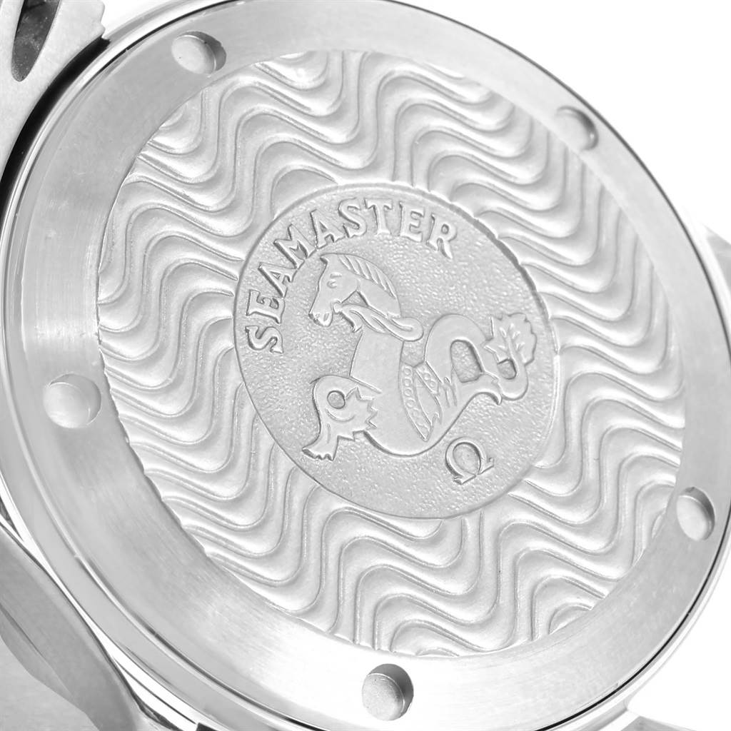 The image shows the intricate back case of an Omega Seamaster 2561.80.00 Men
s Stainless Steel Blue Dial 2561.80.00 Men
s Stainless Steel Blue Dial watch with the engraved logo and wave pattern design.
