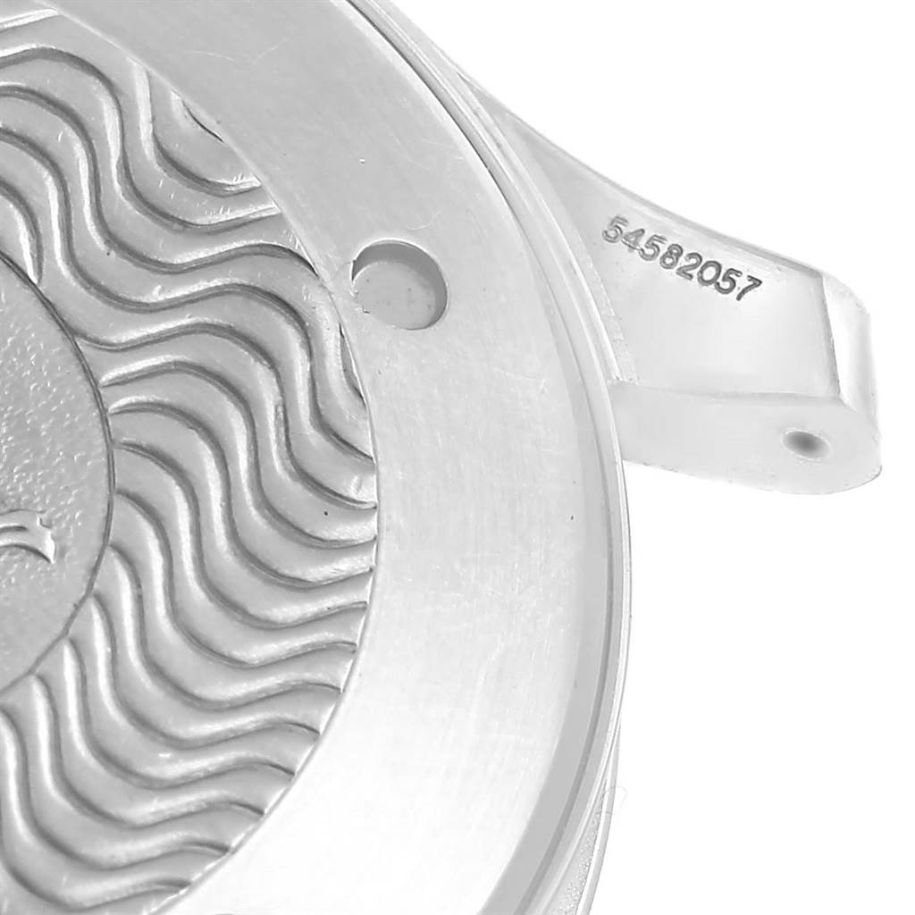 The image shows a close-up of the case back of an Omega Seamaster 2541.80.00 Men
s Stainless Steel Blue Dial 2541.80.00 Men
s Stainless Steel Blue Dial watch, highlighting the wave pattern and serial number.