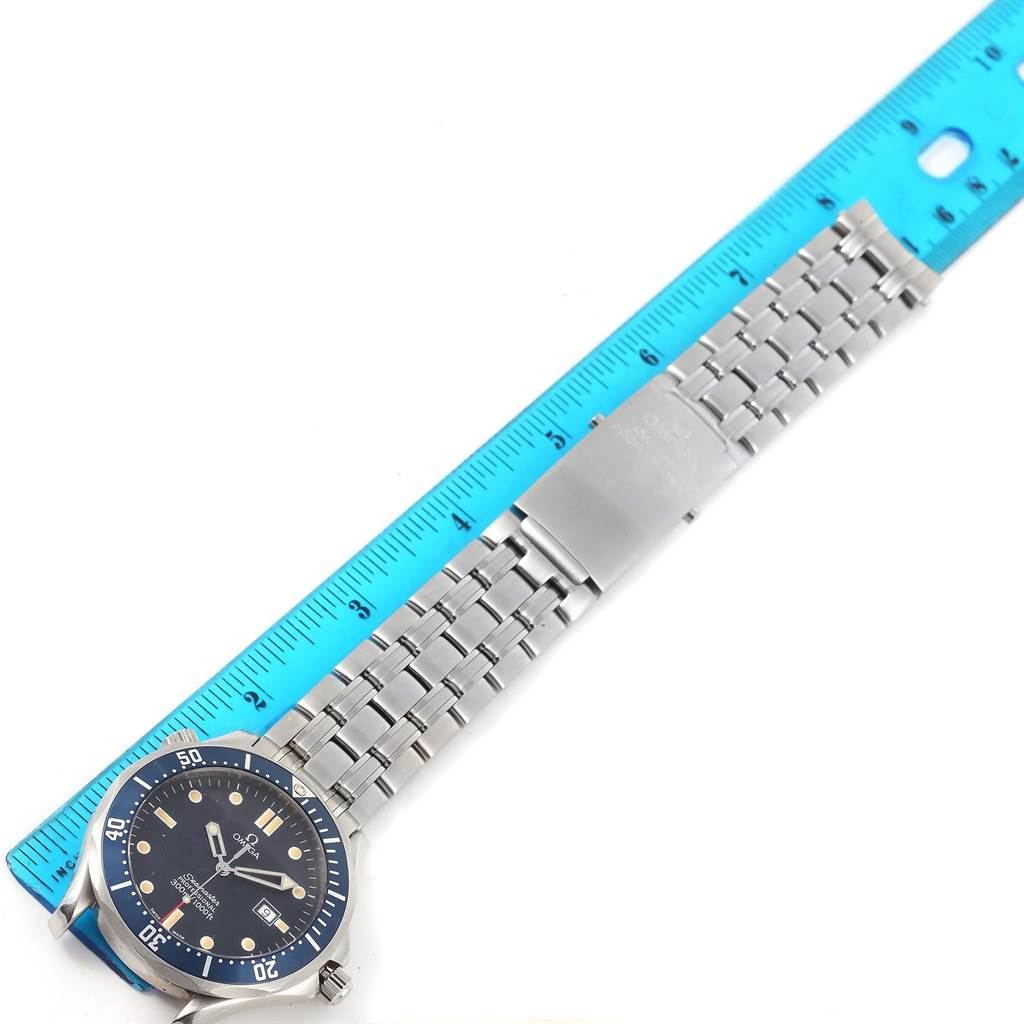 This image shows an Omega Seamaster 2541.80.00 Men
s Stainless Steel Blue Dial 2541.80.00 Men
s Stainless Steel Blue Dial watch lying flat, with a visible clasp and a ruler for scale.