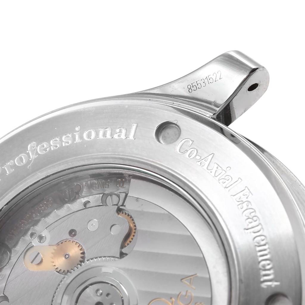 The image shows a close-up of the Omega Seamaster 2535.80.00 Men
s Stainless Steel Blue Dial 2535.80.00 Men
s Stainless Steel Blue Dial
s case back, highlighting the co-axial escapement mechanism and "Professional" inscription.