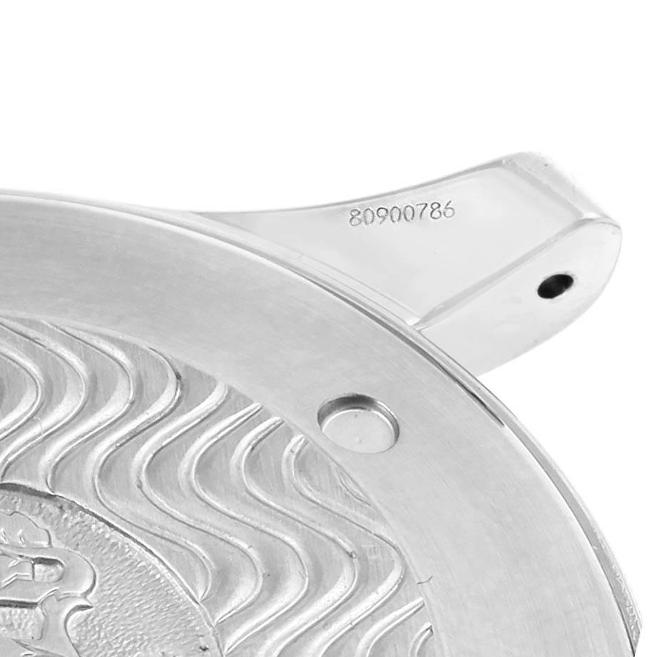 The image shows a close-up of the case back of an Omega Seamaster 2254.50.00 Men
s Stainless Steel Black Dial 2254.50.00 Men
s Stainless Steel Black Dial watch, highlighting its wave pattern and serial number.