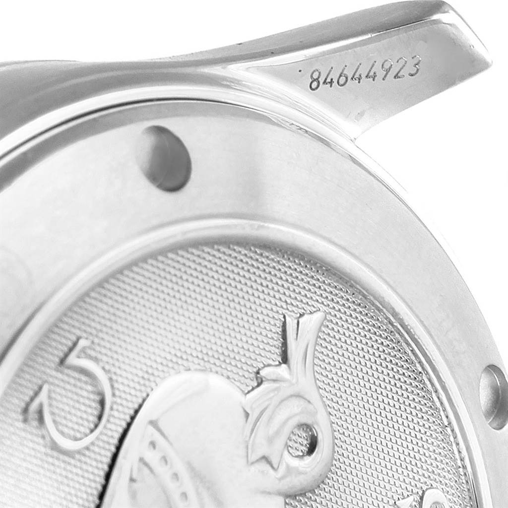 The image shows a close-up of the case back and lug of an Omega Seamaster 2222.80.00 Men
s Stainless Steel Blue Dial 2222.80.00 Men
s Stainless Steel Blue Dial watch, with visible decorative detailing and part of the serial number.