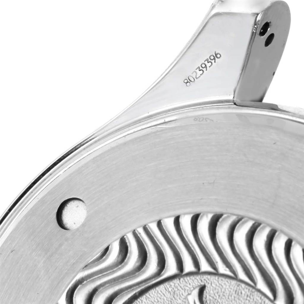 This image shows a close-up of the back casing of an Omega Seamaster 2599.80.00 Men
s Stainless Steel Blue Dial 2599.80.00 Men
s Stainless Steel Blue Dial watch, displaying part of its engraved design and a serial number.