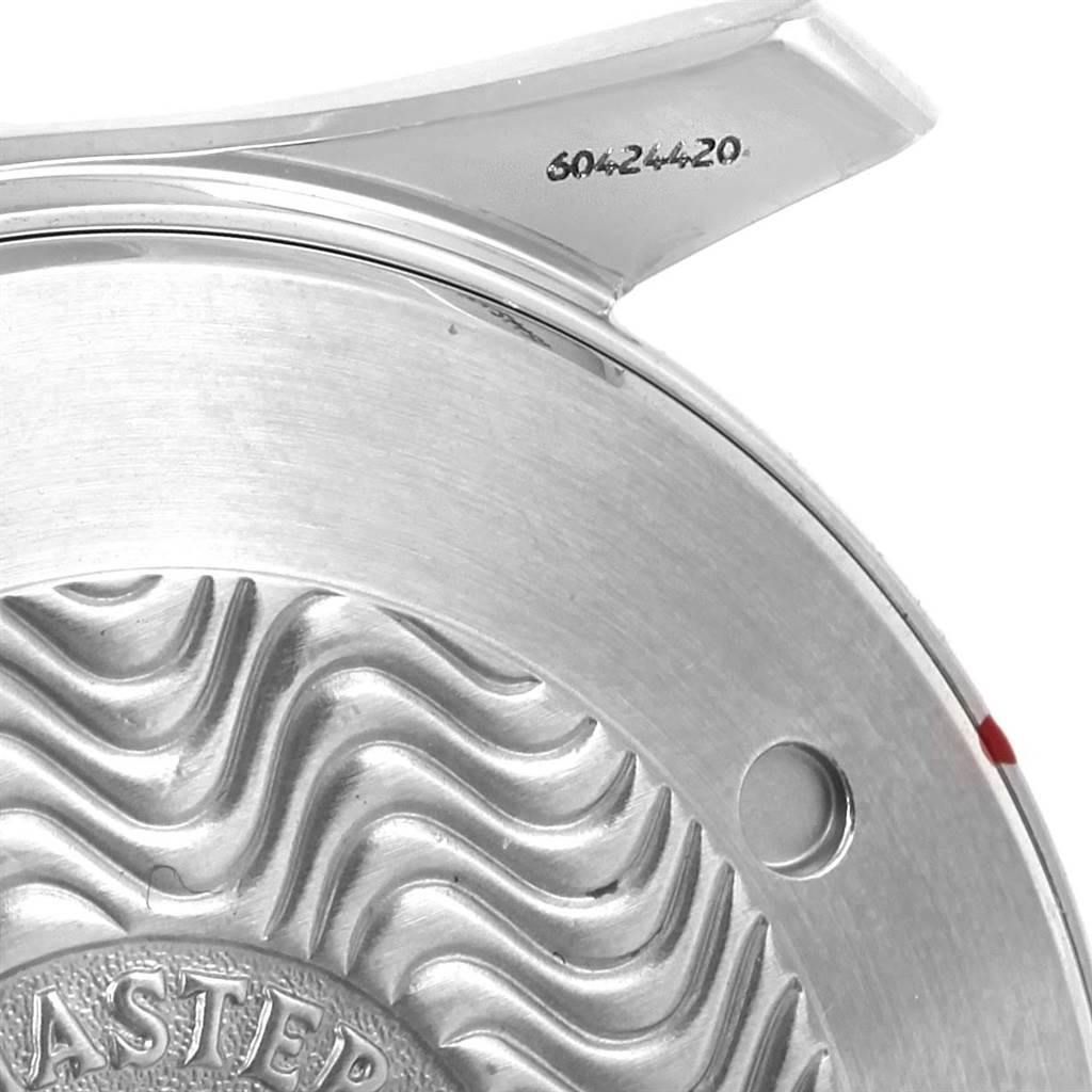 This image shows a close-up of the case back of an Omega Seamaster 2531.80.00 Men
s Stainless Steel Blue Dial 2531.80.00 Men
s Stainless Steel Blue Dial watch, featuring the wave pattern and part of the serial number.