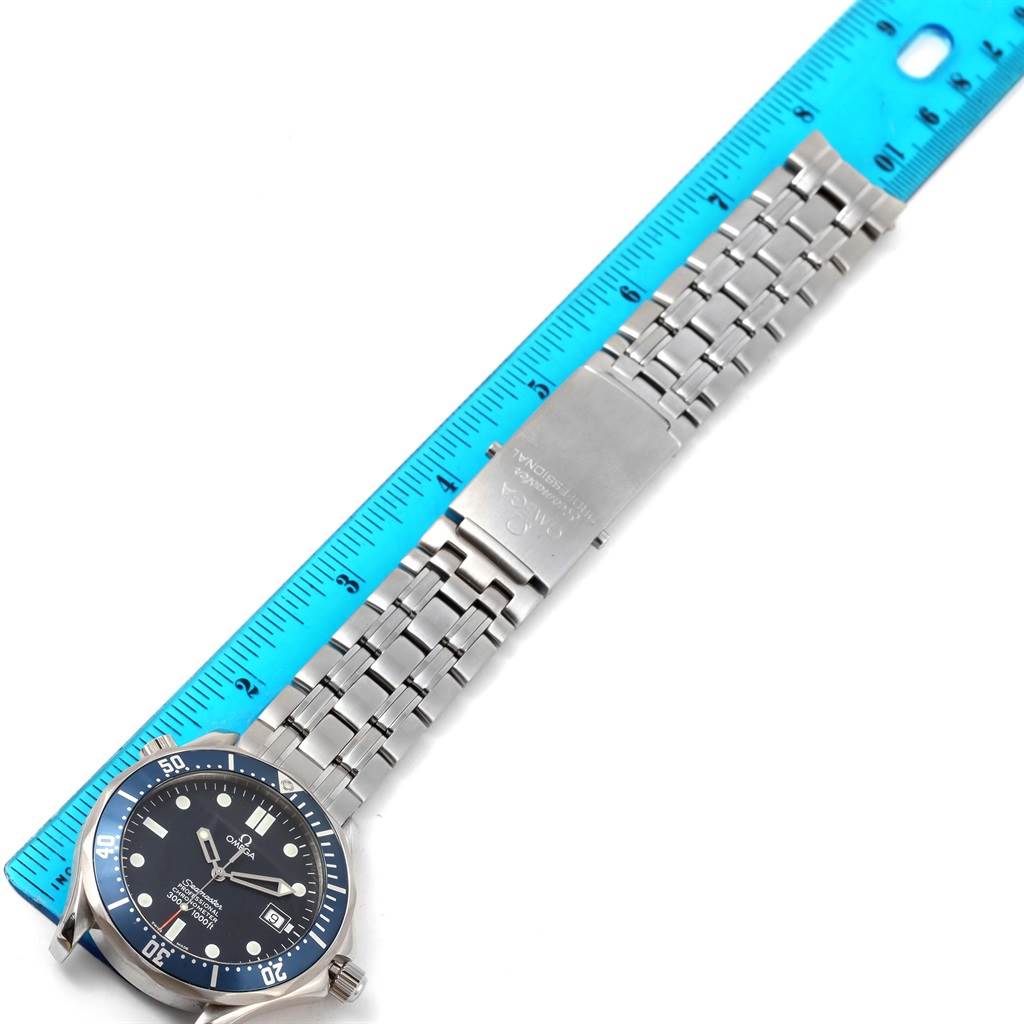 The image shows an Omega Seamaster 2531.80.00 Men
s Stainless Steel Blue Dial 2531.80.00 Men
s Stainless Steel Blue Dial watch from a top-down angle, next to a blue ruler for size comparison.