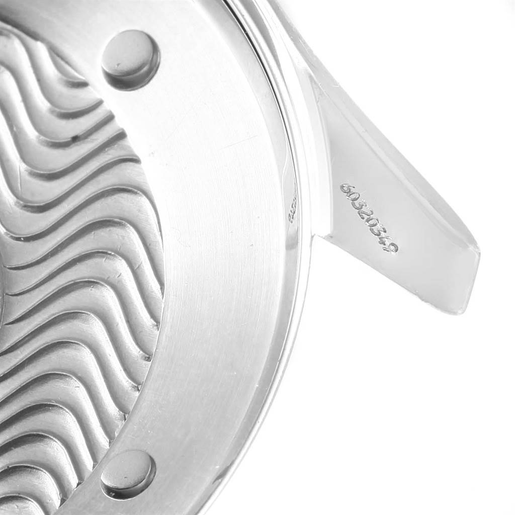 The image shows a partial, close-up view of the Omega Seamaster 2531.80.00 Men
s Stainless Steel Blue Dial 2531.80.00 Men
s Stainless Steel Blue Dial watch case back, emphasizing the wave pattern and serial number.