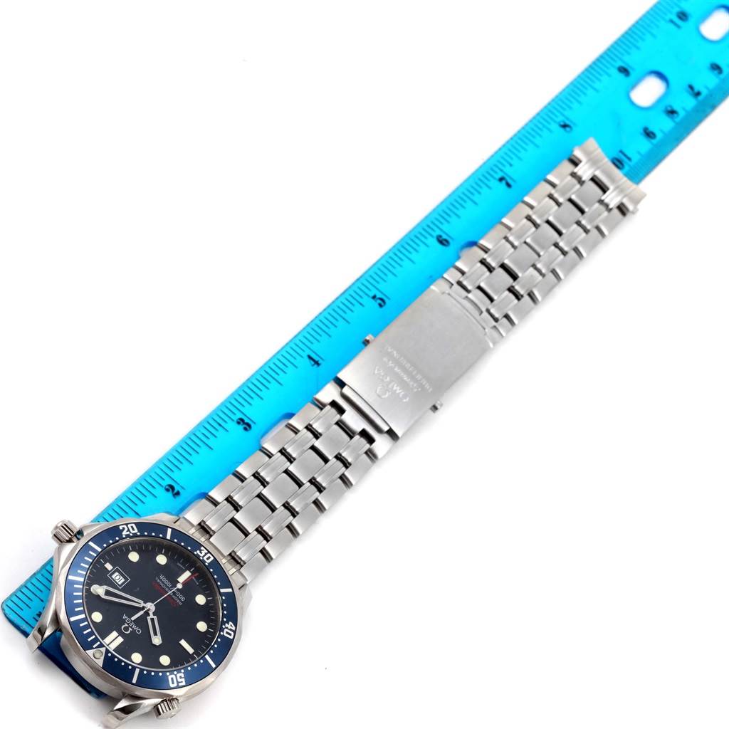 The Omega Seamaster 2221.80.00 Men
s Stainless Steel Blue Dial 2221.80.00 Men
s Stainless Steel Blue Dial watch is shown from an overhead angle, displaying its face, bezel, and stainless steel bracelet with a clasp.