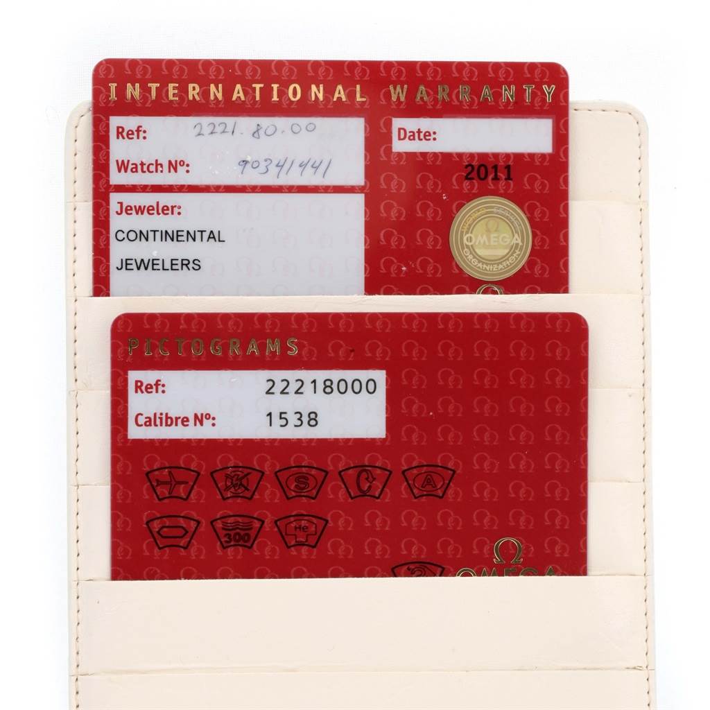 The image shows the warranty and pictogram cards for an Omega Seamaster 2221.80.00 Men
s Stainless Steel Blue Dial 2221.80.00 Men
s Stainless Steel Blue Dial watch, displayed in a white cardholder.