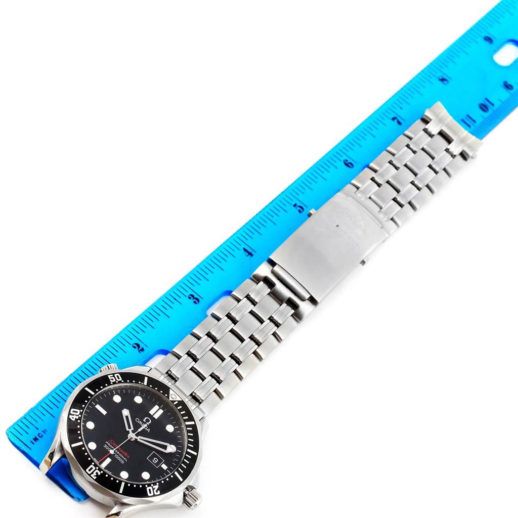 The Omega Seamaster 212.30.41.61.01.001 Men
s Stainless Steel Black Dial 212.30.41.61.01.001 Men
s Stainless Steel Black Dial watch is shown laid flat next to a ruler, displaying its face and metal bracelet.