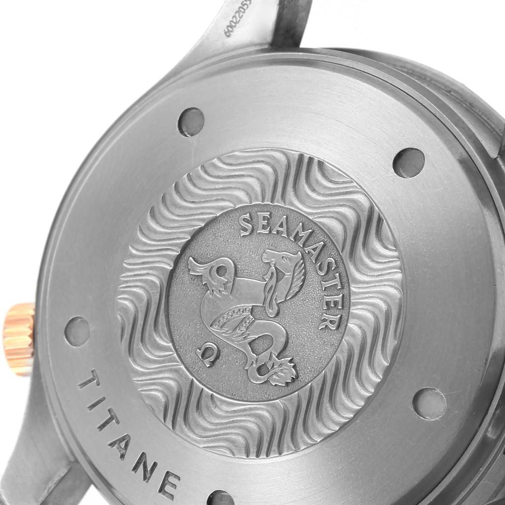 This image shows the back case of an Omega Seamaster 2296.80.00 Men
s Titanium Blue Dial 2296.80.00 Men
s Titanium Blue Dial watch, highlighting the engraved design and branding.