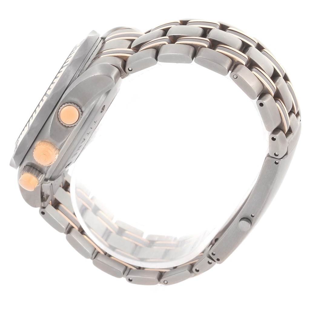 This image shows a side view of the Omega Seamaster 2296.80.00 Men
s Titanium Blue Dial 2296.80.00 Men
s Titanium Blue Dial watch, displaying its crown, pushers, and metal bracelet.