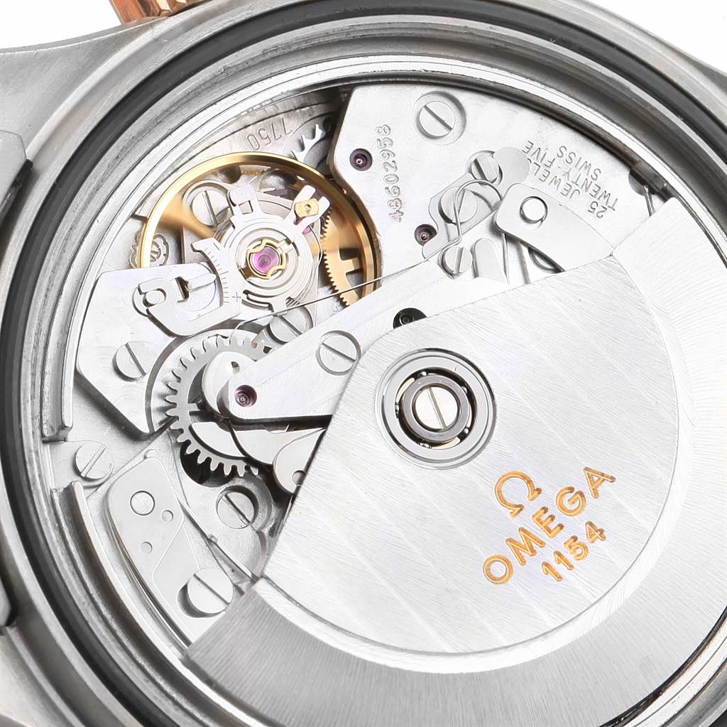 The image shows a close-up of the movement mechanism of an Omega Seamaster 2296.80.00 Men's Titanium Blue Dial 2296.80.00 Men's Titanium Blue Dial watch, highlighting the intricate gears and rotor.