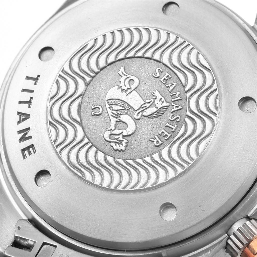 The image shows the case back of an Omega Seamaster 2296.80.00 Men's Titanium Blue Dial 2296.80.00 Men's Titanium Blue Dial watch, highlighting the embossed Seamaster emblem and "Titanium" marking.