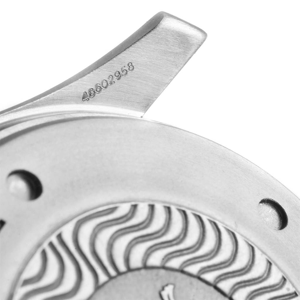 This close-up image shows part of the casing and the lug with engraved serial number of an Omega Seamaster 2296.80.00 Men's Titanium Blue Dial 2296.80.00 Men's Titanium Blue Dial watch.