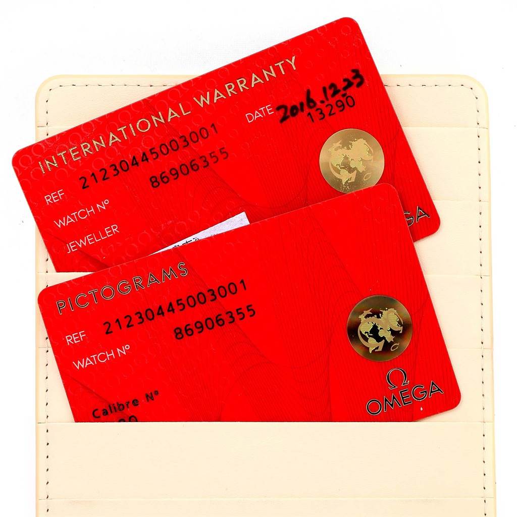 This image shows the international warranty and pictograms cards for an Omega Seamaster 212.30.44.50.03.001 Men
s Stainless Steel Blue Dial 212.30.44.50.03.001 Men
s Stainless Steel Blue Dial watch inside a beige card holder.