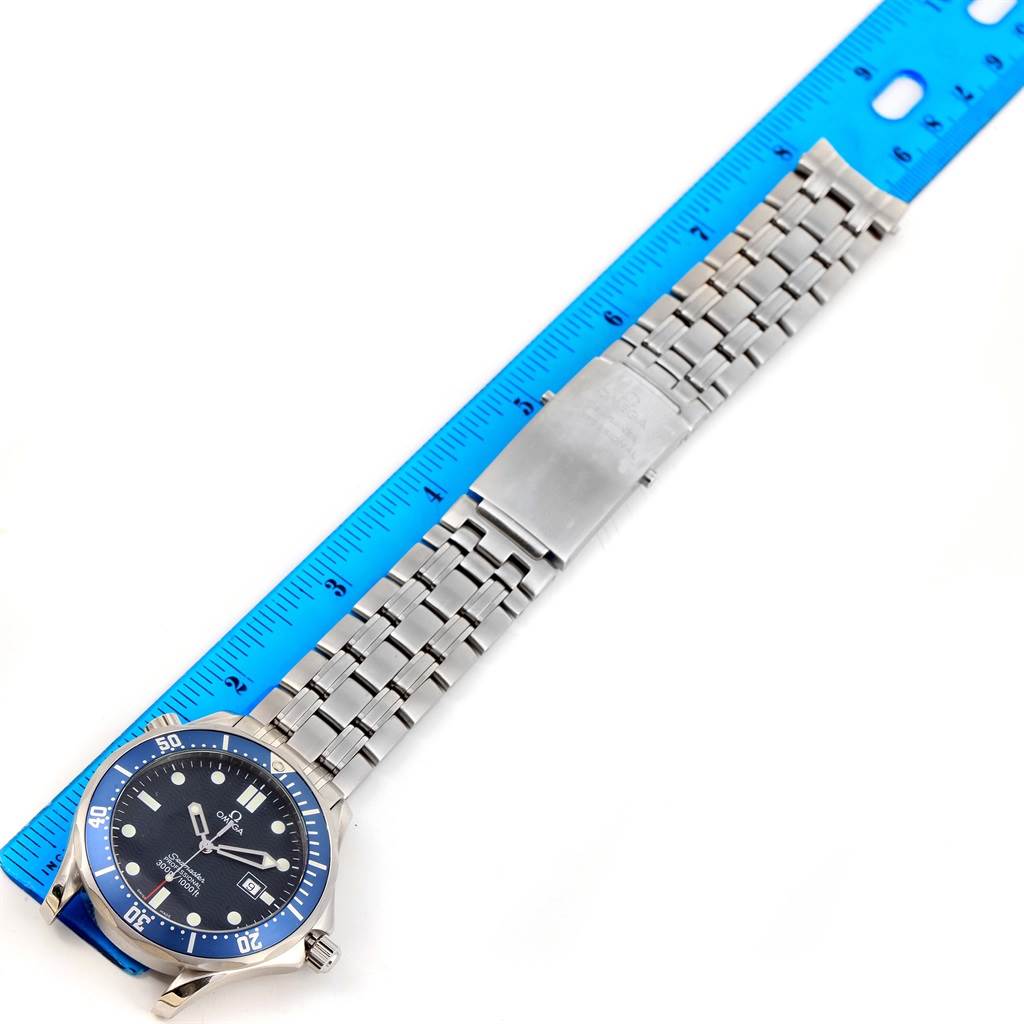 The image shows the Omega Seamaster 2541.80.00 Men
s Stainless Steel Blue Dial 2541.80.00 Men
s Stainless Steel Blue Dial watch laid flat with its stainless steel band extended next to a ruler.