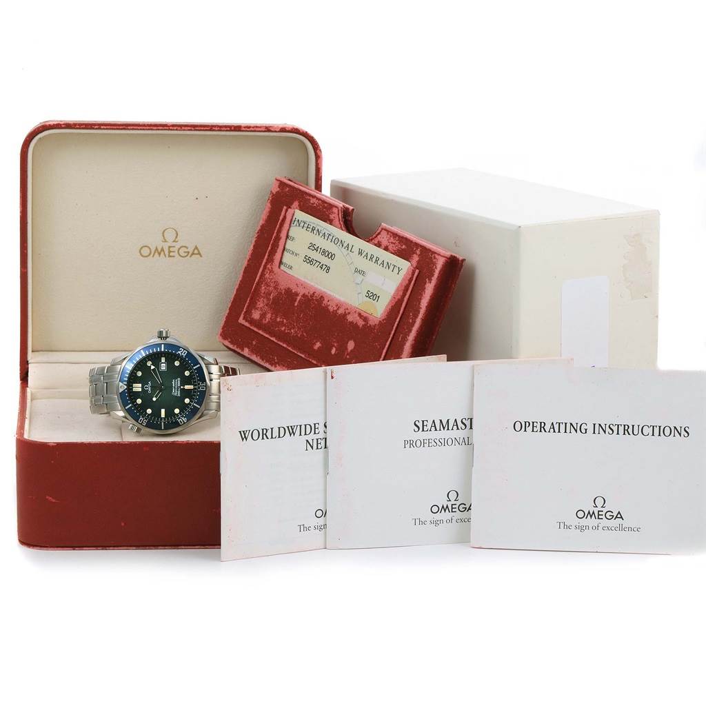 The image shows an Omega Seamaster 2541.80.00 Men
s Stainless Steel Blue Dial 2541.80.00 Men
s Stainless Steel Blue Dial watch in its box, accompanied by an international warranty card and instruction booklets.
