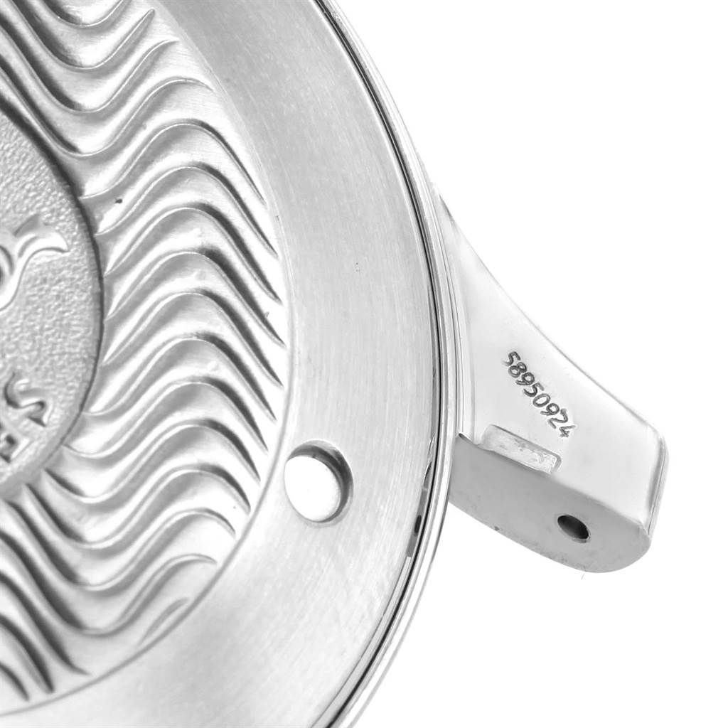 The image shows a close-up of the back case of an Omega Seamaster 2541.80.00 Men's Stainless Steel Blue Dial 2541.80.00 Men's Stainless Steel Blue Dial watch, highlighting part of the wave pattern and serial number.