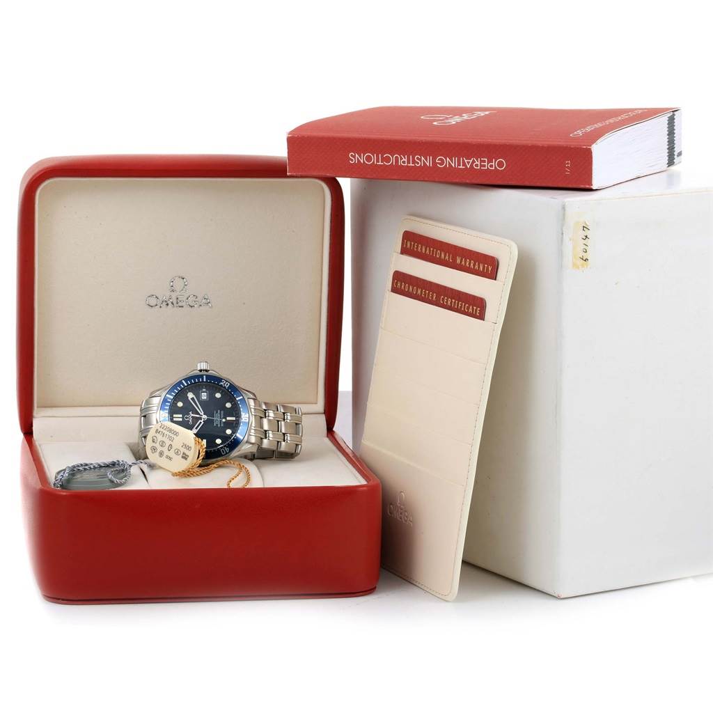 The image shows an Omega Seamaster 2220.80.00 Men
s Stainless Steel Blue Dial 2220.80.00 Men
s Stainless Steel Blue Dial watch along with its box, tags, warranty cards, and instruction manual.