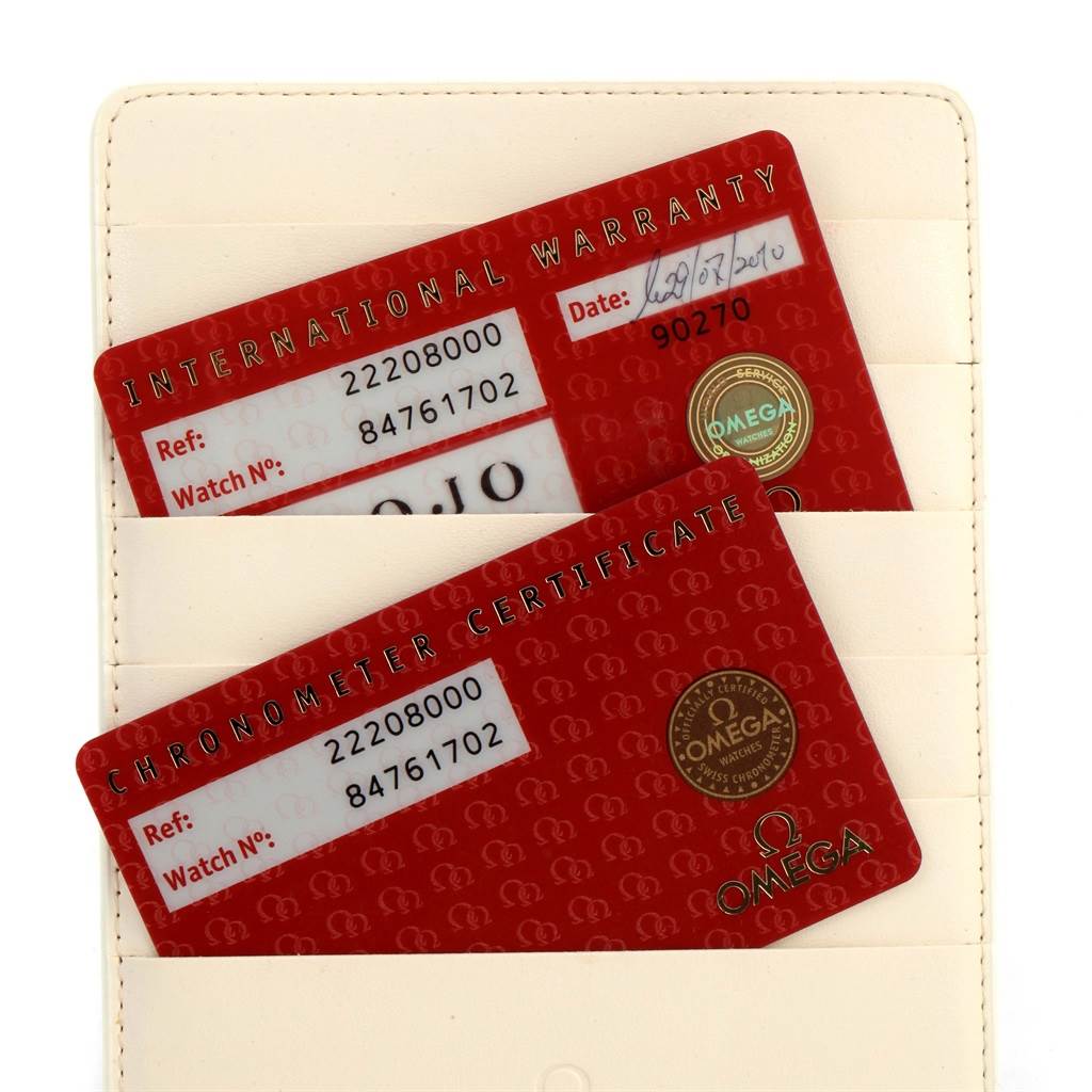 The image shows the International Warranty and Chronometer Certificate cards for an Omega Seamaster 2220.80.00 Men
s Stainless Steel Blue Dial 2220.80.00 Men
s Stainless Steel Blue Dial watch.