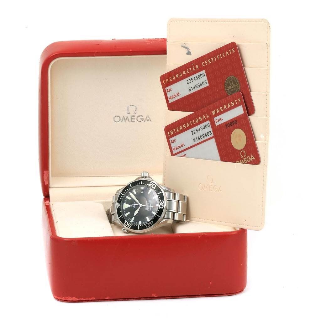 The image shows an Omega Seamaster 2254.50.00 Men
s Stainless Steel Black Dial 2254.50.00 Men
s Stainless Steel Black Dial watch in its box with a chronometer certificate and international warranty cards.