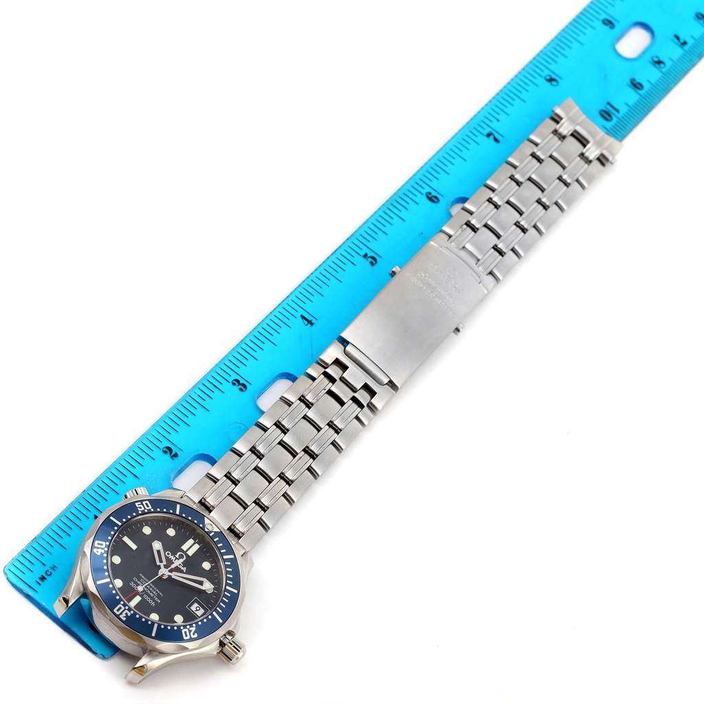 The image shows an Omega Seamaster 2222.80.00 Men
s Stainless Steel Blue Dial 2222.80.00 Men
s Stainless Steel Blue Dial watch laid flat alongside a ruler, displaying the full face and metal bracelet.