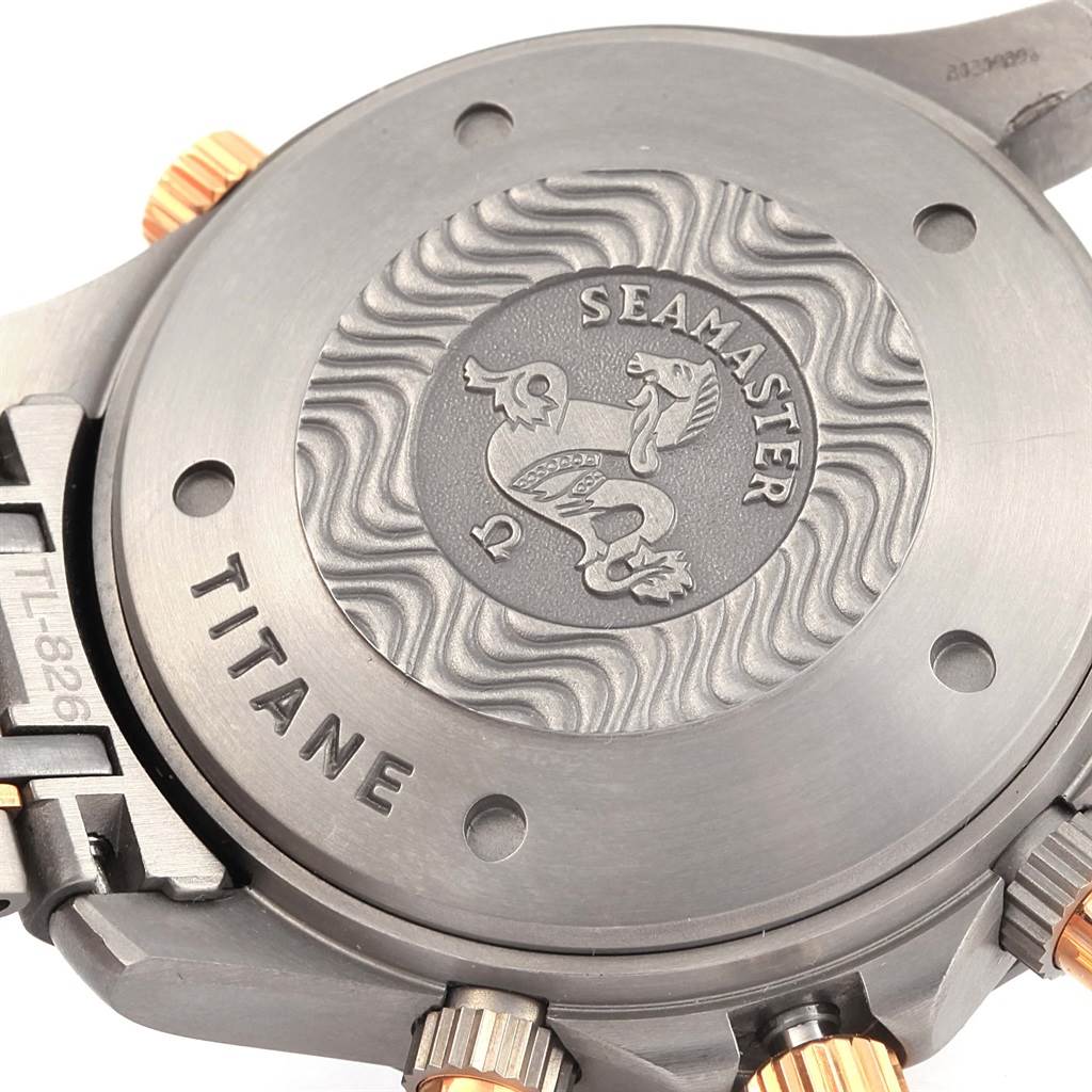 The image shows the titanium caseback of an Omega Seamaster 2296.80.00 Men
s Titanium Blue Dial 2296.80.00 Men
s Titanium Blue Dial watch, featuring its embossed logo and text detailing.