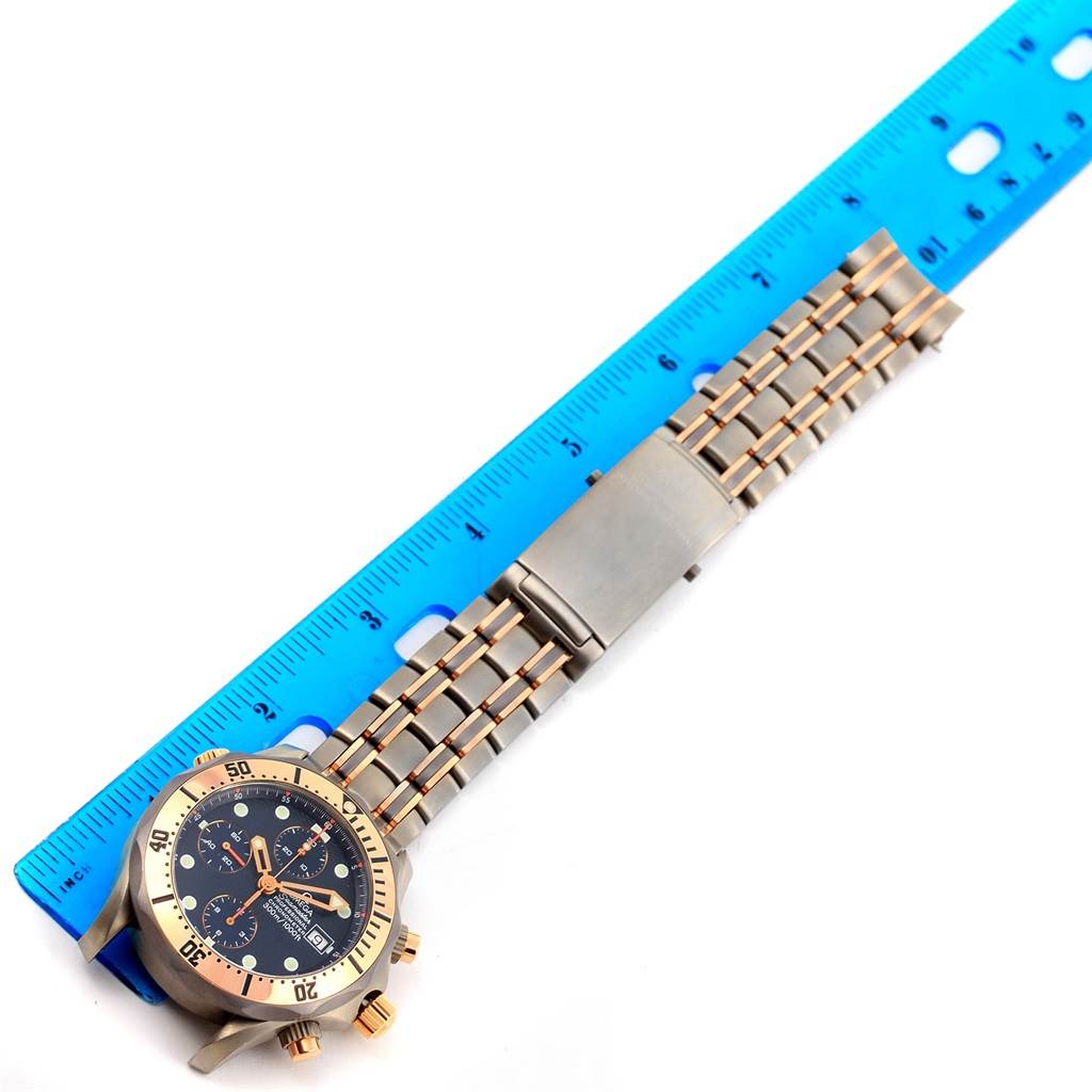 The image shows an Omega Seamaster 2296.80.00 Men
s Titanium Blue Dial 2296.80.00 Men
s Titanium Blue Dial watch, focusing on the face, bezel, wristband, and a ruler for size reference.