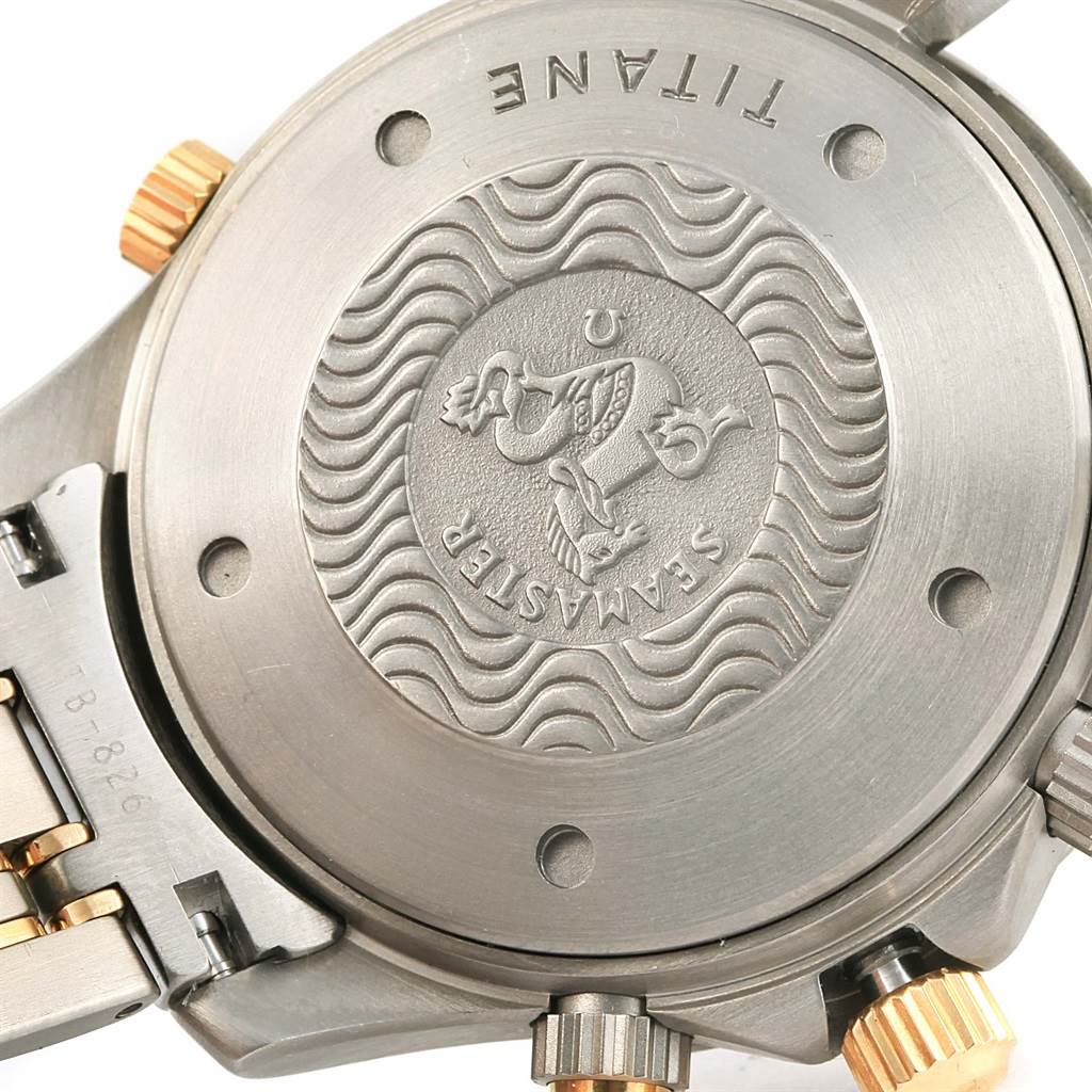 The image shows the back case and part of the band of an Omega Seamaster 2297.80.00 Men
s Titanium Blue Dial 2297.80.00 Men
s Titanium Blue Dial watch, highlighting the embossed design and crown.