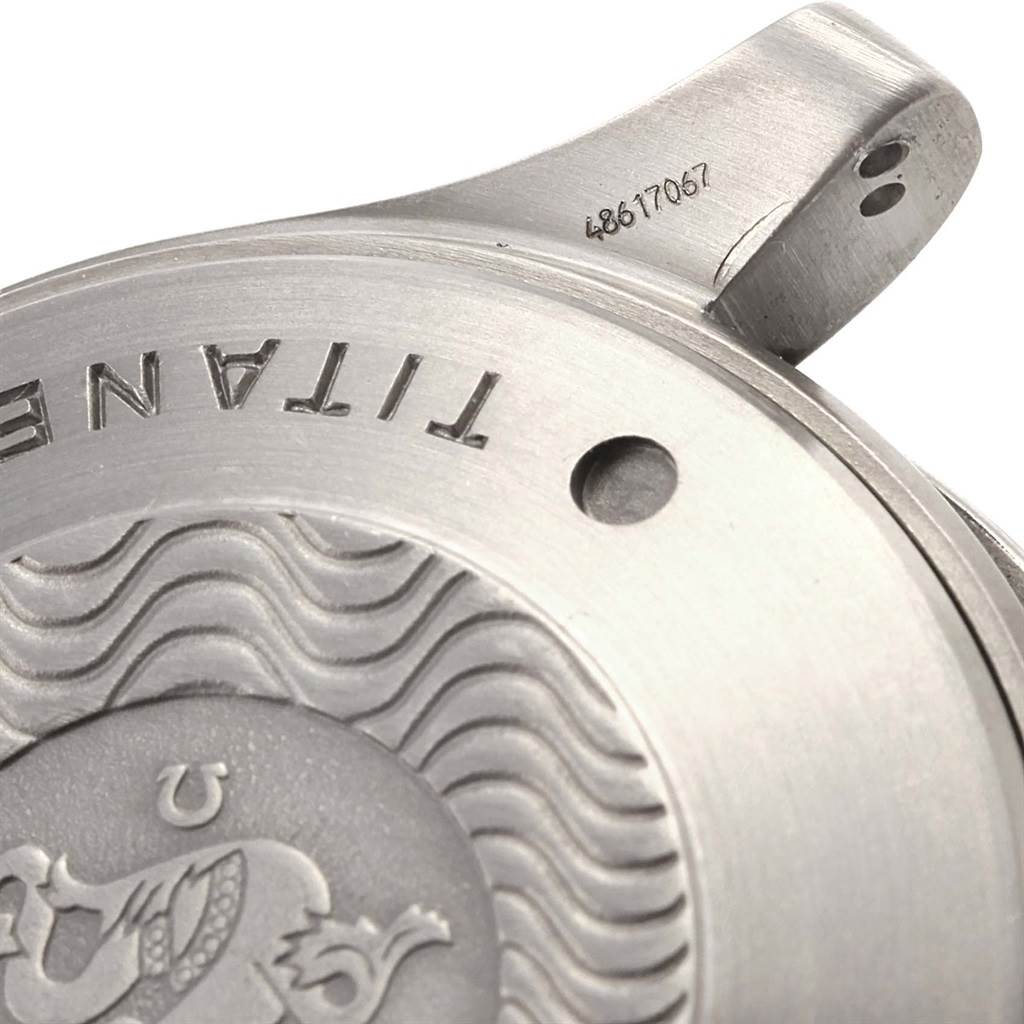 The image shows a close-up of the case back of an Omega Seamaster 2297.80.00 Men
s Titanium Blue Dial 2297.80.00 Men
s Titanium Blue Dial watch, displaying the word "Titanium" and serial number.