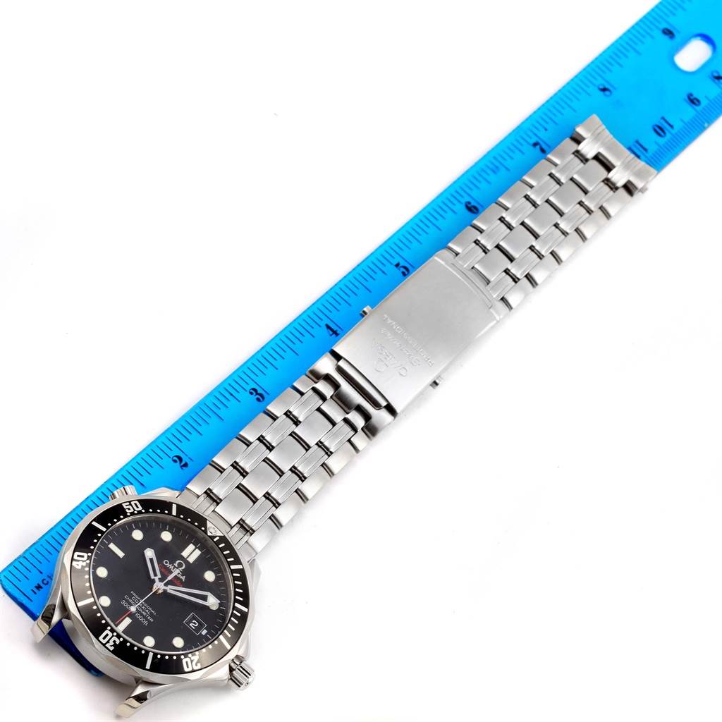 The image shows an Omega Seamaster 212.30.41.20.01.002 Men
s Stainless Steel Black Dial 212.30.41.20.01.002 Men
s Stainless Steel Black Dial watch laid flat with its face and metal bracelet fully visible next to a blue ruler.