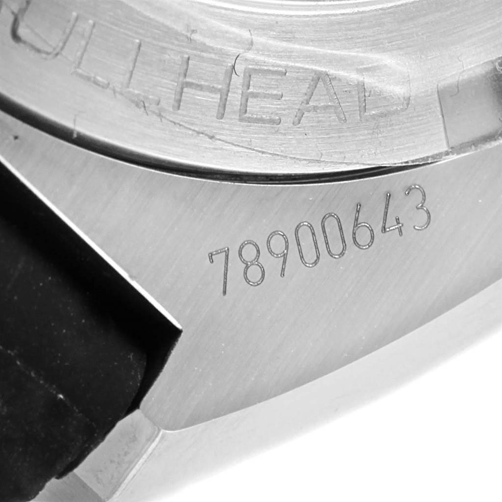 This image shows a close-up of an Omega Seamaster 225.12.43.50.01.001 Men's Stainless Steel Black Dial 225.12.43.50.01.001 Men's Stainless Steel Black Dial watch's engraved serial number on its casing.