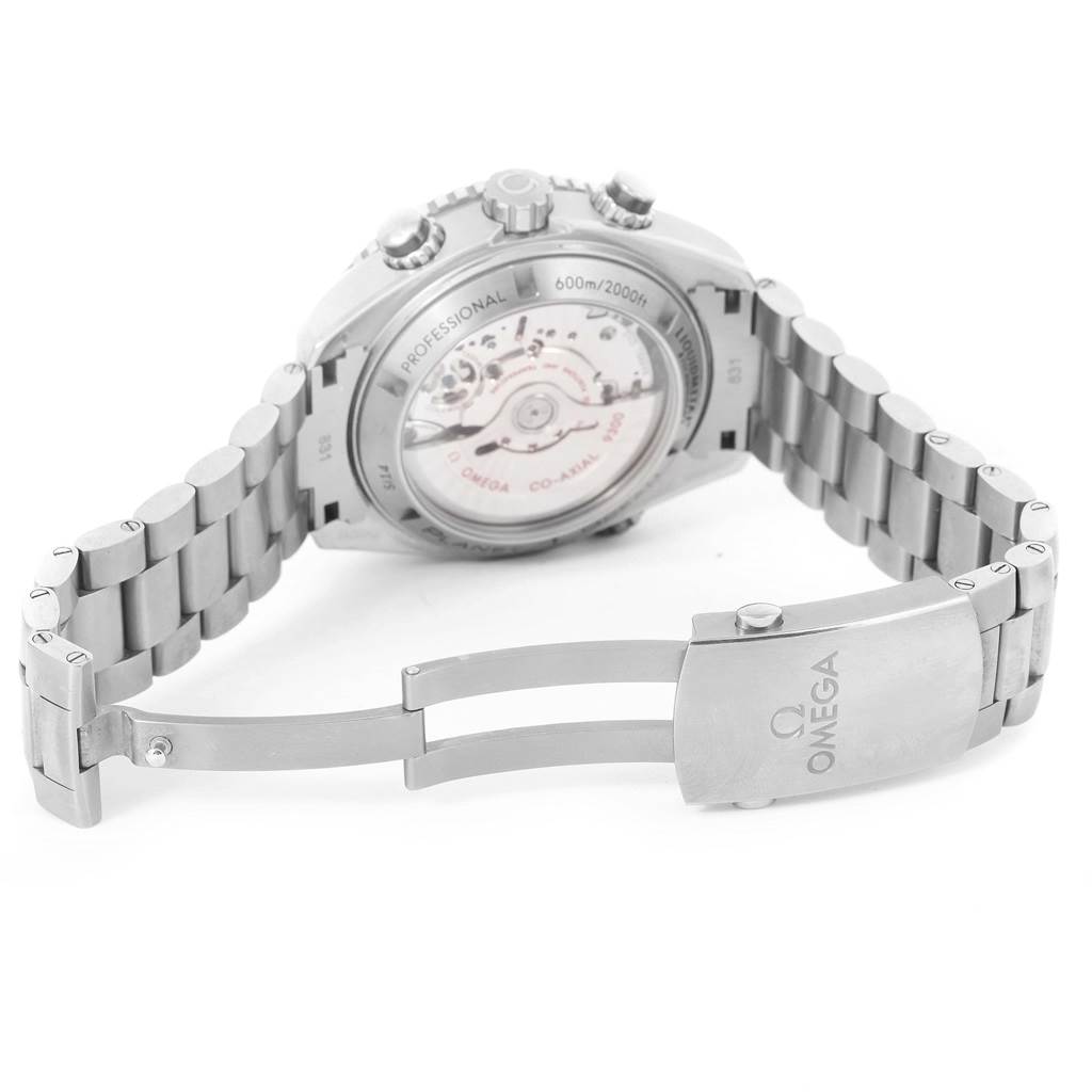 The image shows the stainless steel bracelet and open clasp of the Omega Seamaster 232.90.46.51.03.001 Men's Titanium Blue Dial 232.90.46.51.03.001 Men's Titanium Blue Dial watch, highlighting its back and movement.