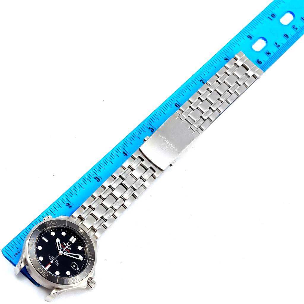 This image shows the face and full bracelet of the Omega Seamaster 212.30.41.20.01.003 Men
s Stainless Steel Black Dial 212.30.41.20.01.003 Men
s Stainless Steel Black Dial watch laid flat, with a blue ruler for measurement.