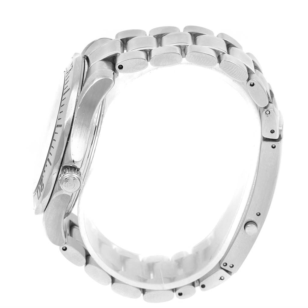 This side view of the Omega Seamaster 2255.80.00 Men
s Stainless Steel Blue Dial 2255.80.00 Men
s Stainless Steel Blue Dial displays its crown, bezel, and metal bracelet.