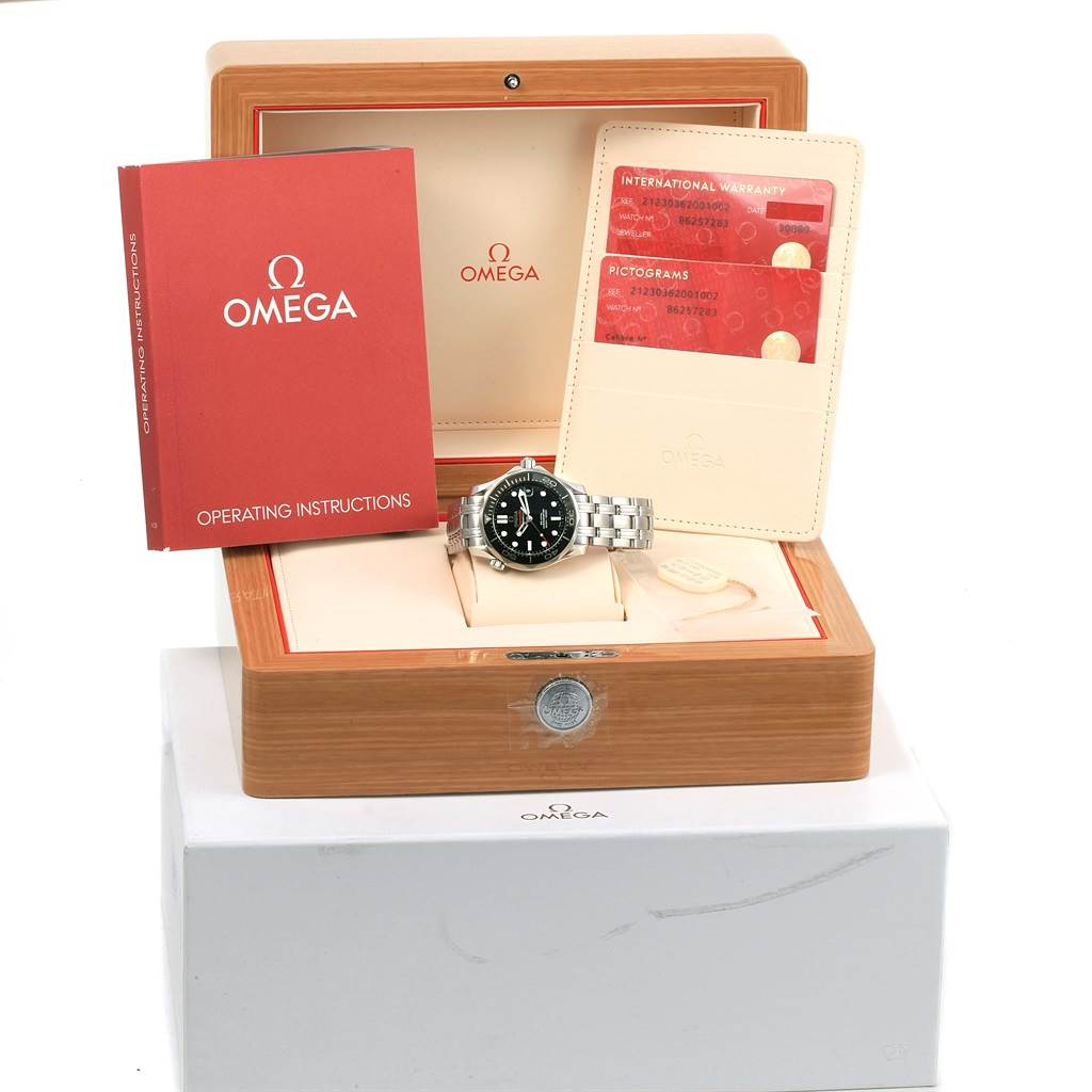 The image shows an Omega Seamaster 212.30.36.20.01.002 Men
s Stainless Steel Black Dial 212.30.36.20.01.002 Men
s Stainless Steel Black Dial watch with its box, warranty cards, and operating instructions from a front angle.