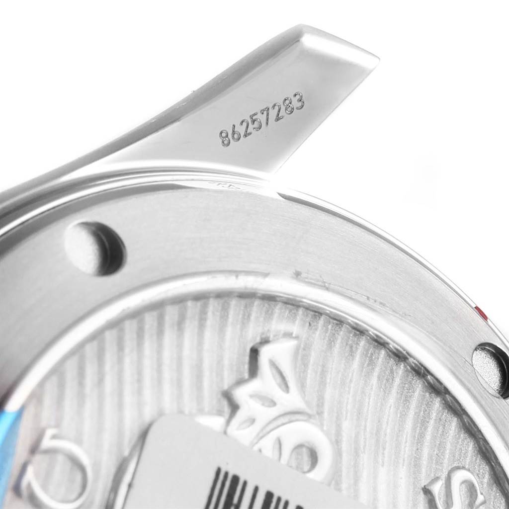 The image shows a close-up of the Omega Seamaster 212.30.36.20.01.002 Men
s Stainless Steel Black Dial 212.30.36.20.01.002 Men
s Stainless Steel Black Dial
s case back and lugs, highlighting the serial number and part of the engraved logo.