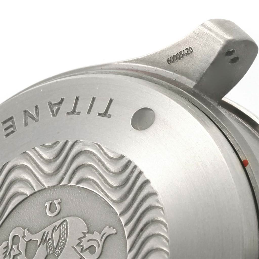 This image shows a close-up of the case back of an Omega Seamaster 2298.80.00 Men
s Titanium Blue Dial 2298.80.00 Men
s Titanium Blue Dial watch, highlighting the engraved details and "TITANE" lettering.